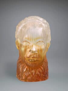 white and orange glass sculptor of a head