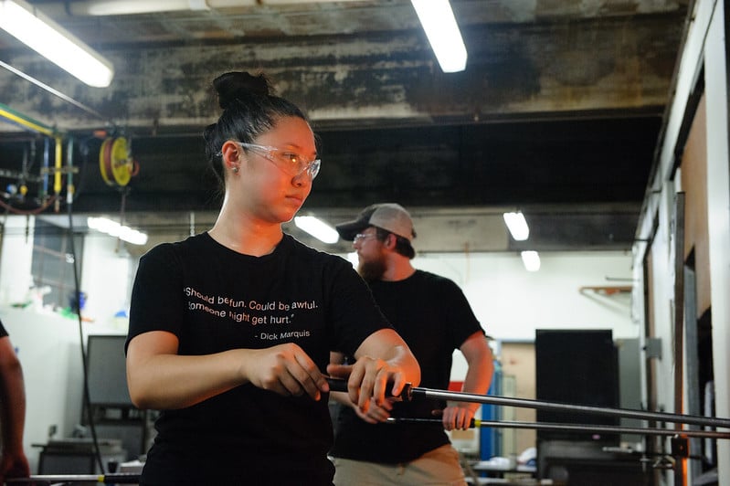 artist working with glass