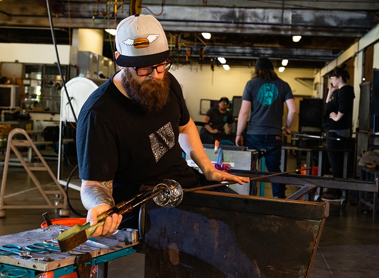 man working with glass