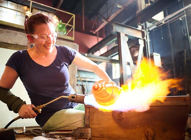 Quade blowing glass on blown away