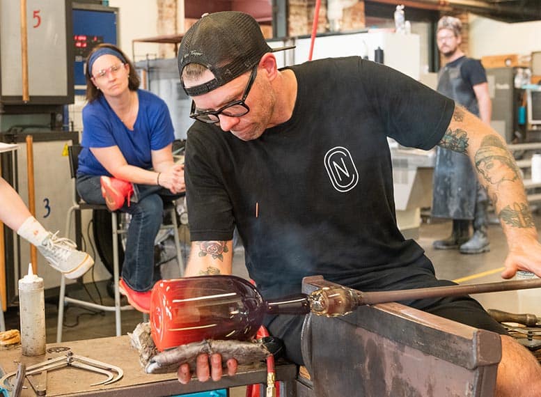 Nate Cotterman blowing glass