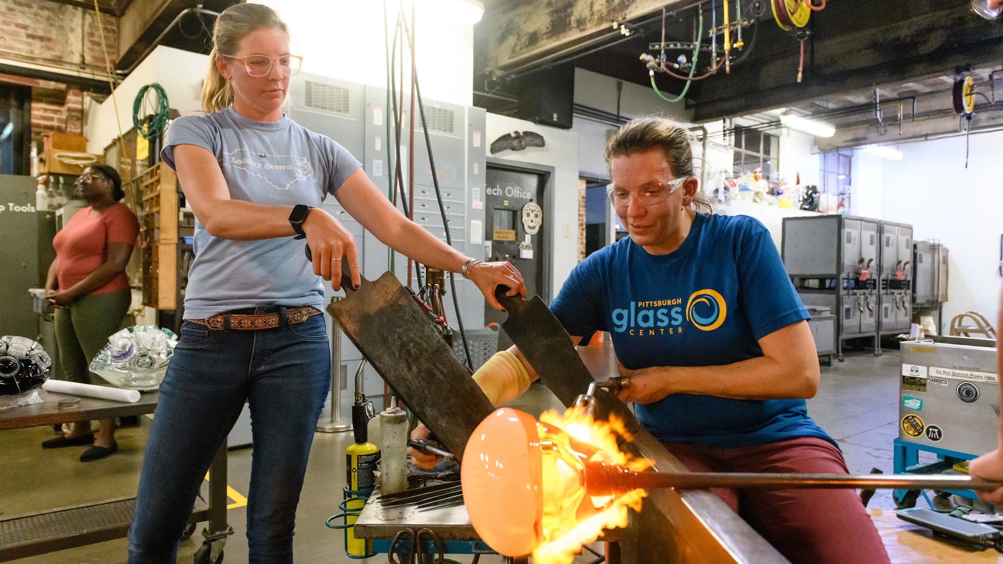 2 women blowing glass
