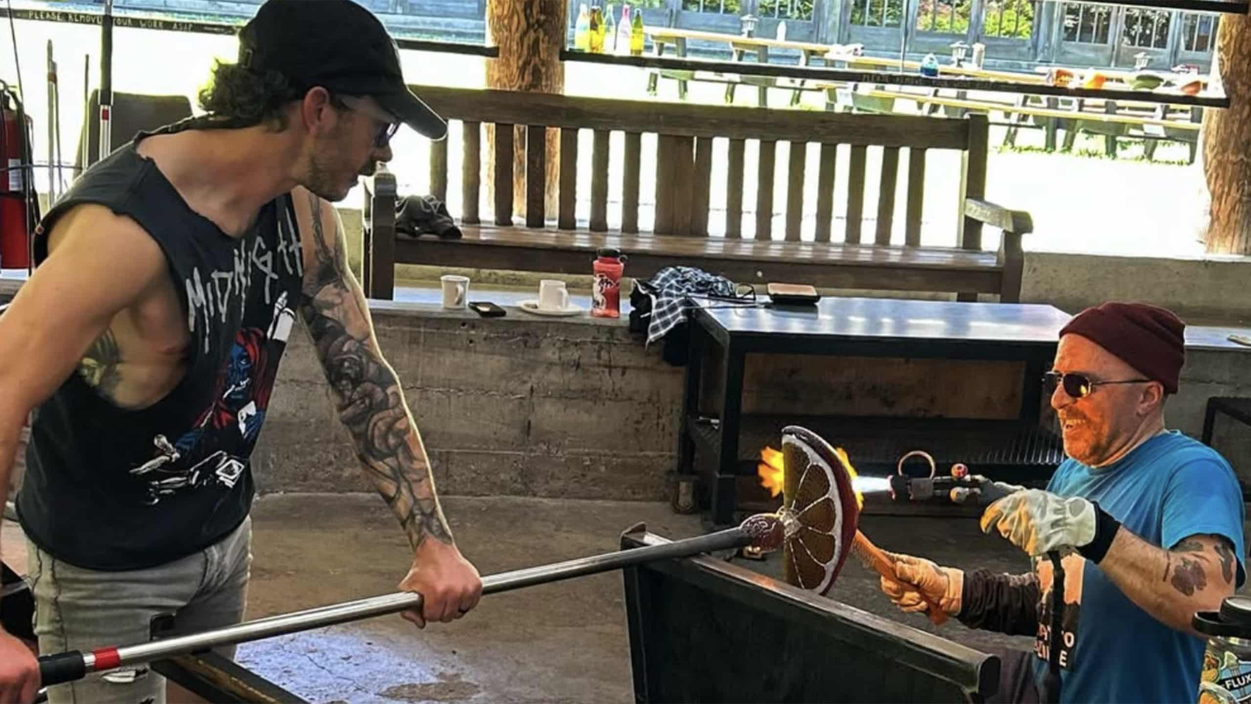 Mark Leputa and Steve Hagan blowing glass.