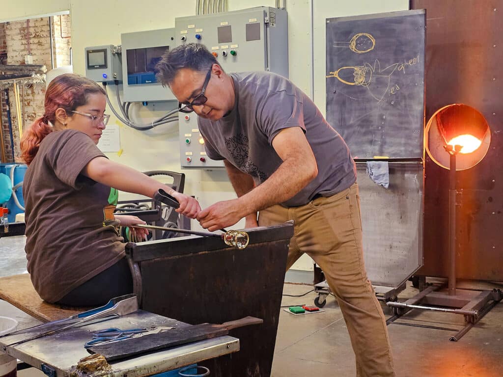 Jaime Guerrero teaching youth at Pittsburgh Glass Center