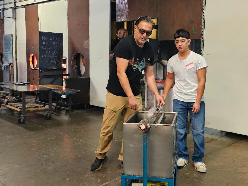 Jaime Guerrero teaching youth at Pittsburgh Glass Center
