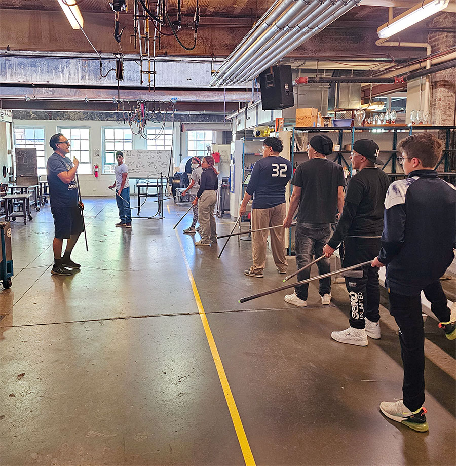 Jaime Guerrero teaching youth at Pittsburgh Glass Center