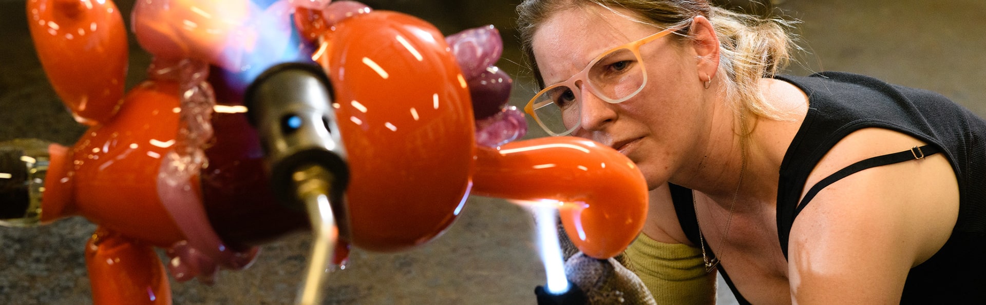 glassblowing and creating a colorful creature