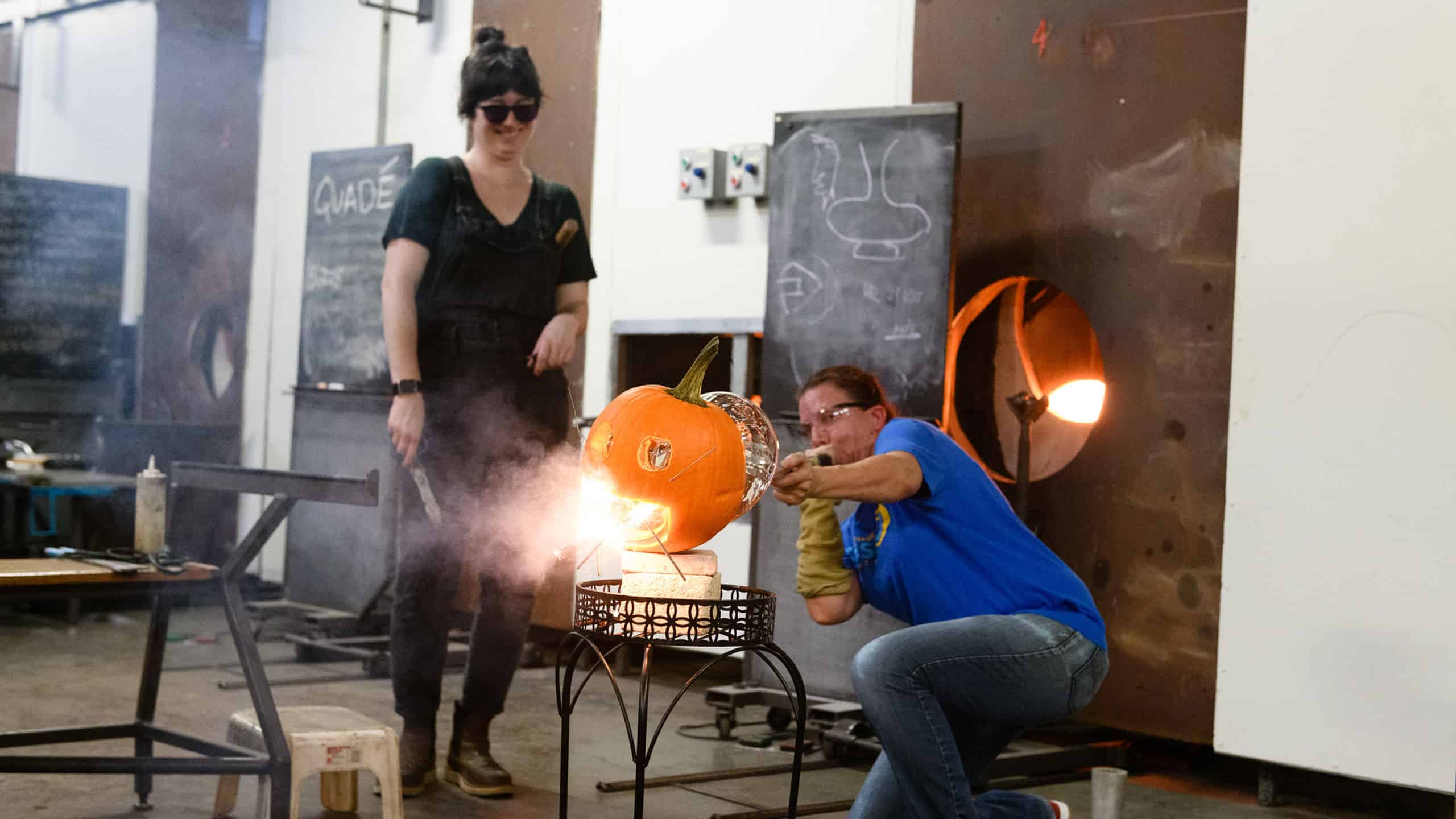 Blowing glass into a pumpkin