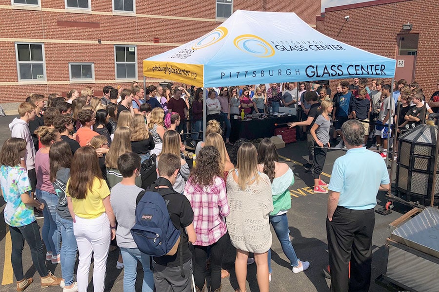 Students watching Hot Wheels Mobile Furnace at their school
