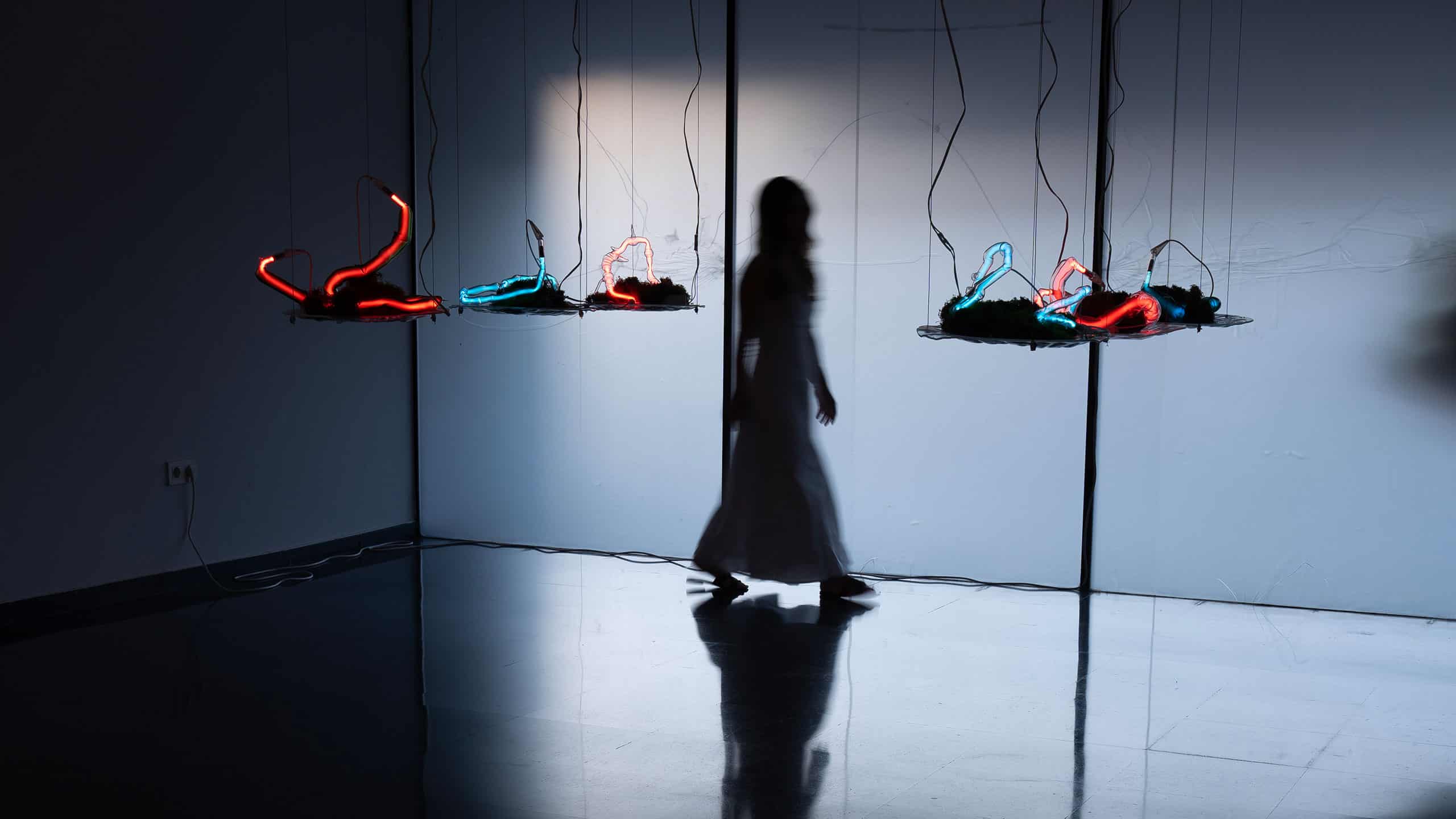 Dia Munoz and a neon sculpture
